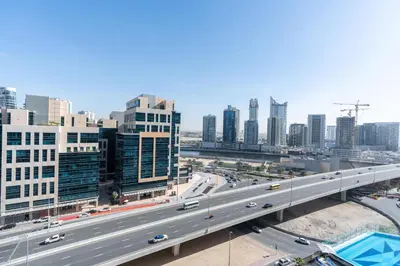 a highway in a city with cars on it at White Sage - Elite Residence 1 bedroom in Dubai