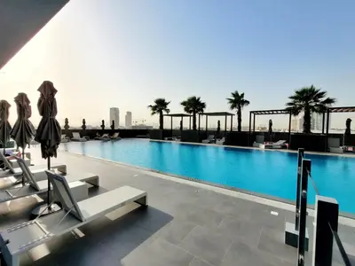 a swimming pool on the roof of a building at Bloom Height Tower in Dubai
