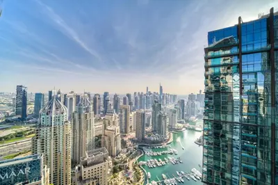 an aerial view of a city with a river and buildings at The Marina PENTHOUSE near JBR 46th Floor in Dubai