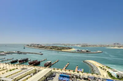 a view of a harbor with boats in the water at Idyllic 1BR at Sunrise Bay Tower 1 Emaar Beachfront Dubai Marina by Deluxe Holiday Homes in Dubai