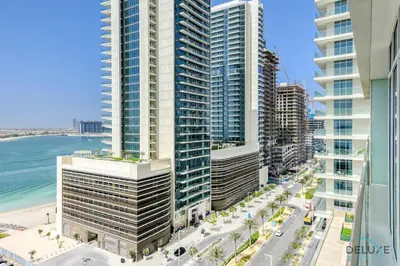 an aerial view of a city with tall buildings and the ocean at Idyllic 1BR at Sunrise Bay Tower 1 Emaar Beachfront Dubai Marina by Deluxe Holiday Homes in Dubai