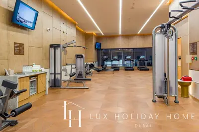 a gym with exercise equipment in a room at LUX Iconic Views at The Palm Tower Suite 1 in Dubai