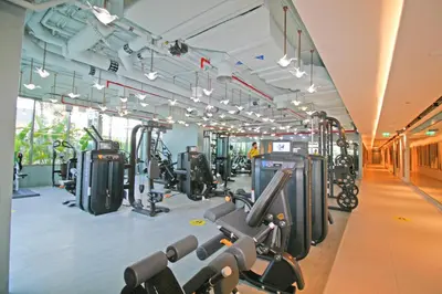 a gym with lots of treadmills and machines at Luxury MAG 318 Studio Near Dubai Mall in Dubai