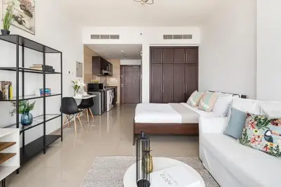 a living room with a white couch and a table at Frank Porter - Siraj Tower in Dubai