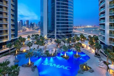 an aerial view of a resort with a blue pool at DAMAC Towers by Paramount Hotels & Resorts Dubai in Dubai