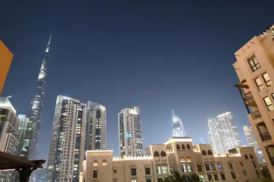 a view of a city with tall skyscrapers and buildings at Burj Khalifa view, birds chirping, cozy and stylish in Dubai