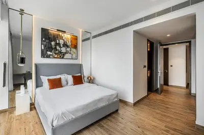 a bedroom with a large bed with white sheets at 2BR Marina Gate 3 High Floor Marina View in Dubai