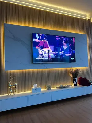 a television on a wall in a room at boulevard point view in Dubai