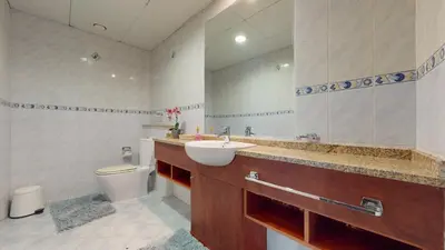a bathroom with a sink and a toilet at LV38 - Elegant 2BHK in Lake View Tower in Dubai