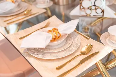 a table with a bowl of food on a table at Elite Royal Apartment - Panoramic Burj Khalifa, Fountain & Dubai skyline view - Marquise in Dubai