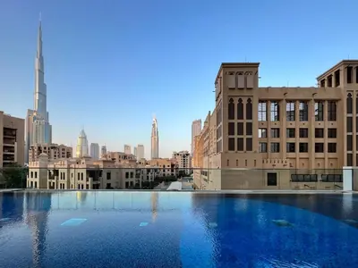 a large pool of water in a city with buildings at Silkhaus unique 1BDR pad gorgeous view in new tower in Dubai