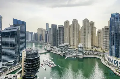 a view of a river in a city with tall buildings at Steps Away From Marina Mall with Iconic Marina Canal Views, The Address Residences, Dubai Marina by Deluxe Holiday Homes in Dubai