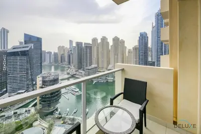 a balcony with a view of a city at Steps Away From Marina Mall with Iconic Marina Canal Views, The Address Residences, Dubai Marina by Deluxe Holiday Homes in Dubai