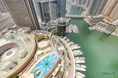 an aerial view of a city with buildings and boats at Marina Gem with Overlooking Canal Views 1BR Next to Mall, The Address Residences, Dubai Marina by Deluxe Holiday Homes in Dubai