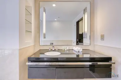 a bathroom with a sink and a mirror at Upscale Studio at The Address Residences Dubai Marina by Deluxe Holiday Homes in Dubai