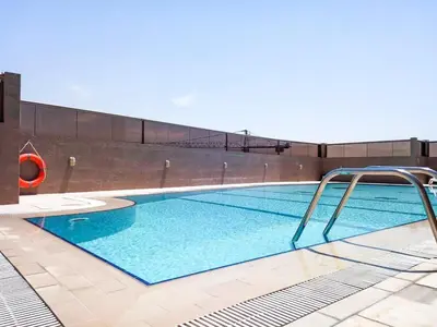 a swimming pool with blue water in a building at Frank Porter - Elite Sports Residence in Dubai