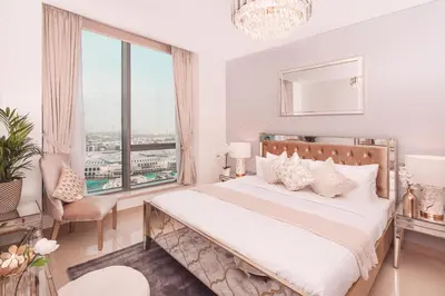 a bedroom with a bed and a large window at Elite Royal Apartment - Highest Floor - Full Burj Khalifa & Fountain View - Duke in Dubai