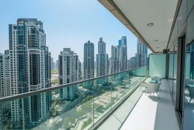an apartment balcony with a view of the city at Paramount Midtown -Stunning 2 Bedroom Apt with Burj-Khalifa view in Dubai