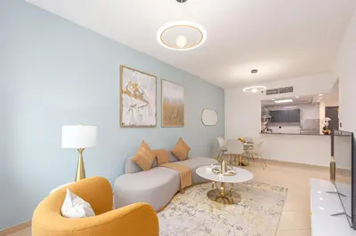 a living room with a couch and a table at Marco Polo - Find your calm escape in Dubai Marina in Dubai