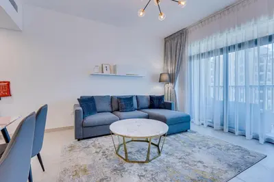 a living room with a couch and a table at Luxury 1BD apartment in Madinat Jumeirah Living in Dubai