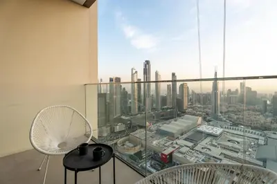 a room with a view of a city at GuestReady - Luxury Tower with Burj Khalifa View in Dubai
