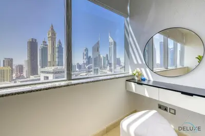 a bathroom with a window with a view of the city at Welcoming Studio at Sky Gardens DIFC By Deluxe Holiday Homes in Dubai