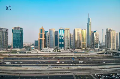 a city with a highway and many tall buildings at Luxury Escapes - Modern studio in West Avenue Dubai Marina in Dubai