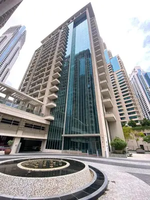 a tall building with a fountain in front of it at Silkhaus lovely studio with Downtown view in Boulevard central in Dubai