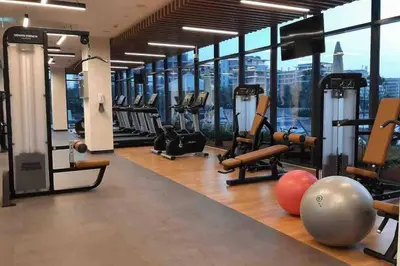 a gym with treadmills and exercise equipment in a building at 2 Bedroom Apartment Available For Short Term Stay in Dubai