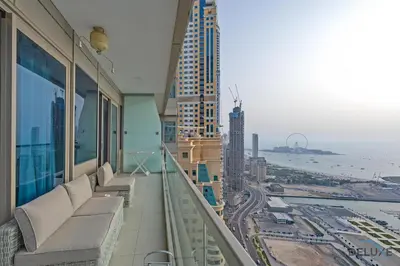 a balcony of a building with a view of the ocean at Scenic 1BR at Ocean Heights Dubai Marina by Deluxe Holiday Homes in Dubai