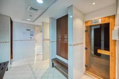 a hallway with a door in a building at White Sage - Luxurious Studio in JLT With City Skyline View in Dubai