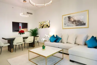 a living room with a couch and a table at Elegant Apartment with Direct access to Dubai Mall in Dubai