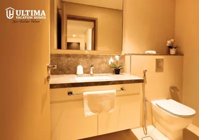 a bathroom with a sink and a toilet at Elegant Apartment with Direct access to Dubai Mall in Dubai