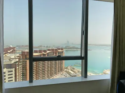 a view of the ocean from a hotel window at The Smart Concierge - Palm tower in Dubai