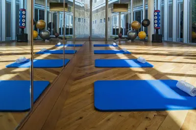 a row of blue mats in a gym at FAHH Stunning 1 BHK at Address Dubai Mall in Dubai