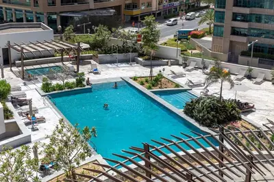 an overhead view of a swimming pool in a city at Frank Porter - Silverene Tower B in Dubai