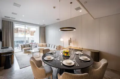 a dining room with a table and chairs at FIVE Palm Jumeirah Residences - Mint Stay in Dubai