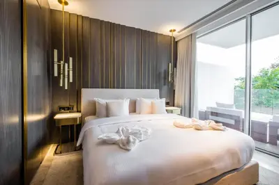 a bedroom with a large white bed with bows on it at FIVE Palm Jumeirah Residences - Mint Stay in Dubai