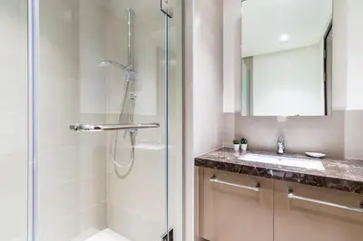 a bathroom with a shower and a sink at GuestReady - Magnificent heart of Downtown in Dubai