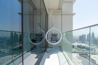 two mirrors in a room with a view of a city at Avani Palm Burj-AlArab View from the pool in Dubai
