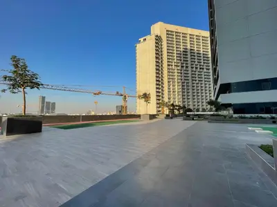 a large plaza in a city with tall buildings at Apartment on 26th Floor & Beautiful Views (2 adults + 2 kids) in Dubai