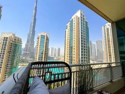 a balcony with a view of a city skyline at HiGuests - Amazing Apartment overlooking Burj Khalifa! in Dubai