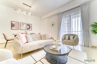 a living room with a couch and chairs and a table at Impeccable 2BR at Bahar 2 JBR by Deluxe Holiday Homes in Dubai