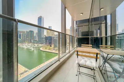 a balcony with a view of a river at Rustic 2BR at Sparkle Tower 1 Dubai Marina by Deluxe Holiday Homes in Dubai
