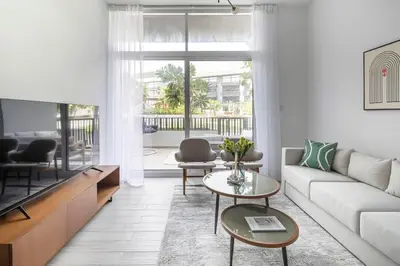 a living room with a couch and a table at Frank Porter - Belgravia 3 in Dubai