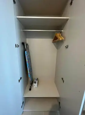 a skateboard sitting on a shelf in a closet at OYO 887 Home A1607 Sobha Creek Vistas - 1BR in Dubai