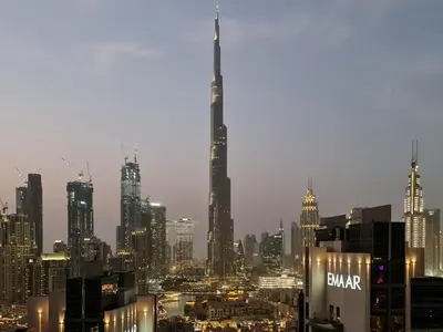 a view of a large city at night at Trophy Elite Elegance Suites with Panaromic Burj Khalifa Views in Dubai