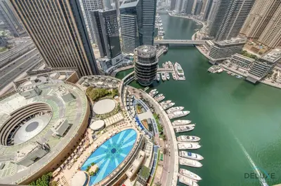 an aerial view of a city with buildings and boats at Lush 1 BR at The Address Residences Dubai Marina by Deluxe Holiday Homes in Dubai