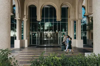 a group of people walking in front of a building at Marriott Hotel Al Jaddaf, Dubai in Dubai