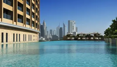 a large pool of water with a city in the background at FAHH - Superior 1BHK Address Dubai Mall Residences in Dubai